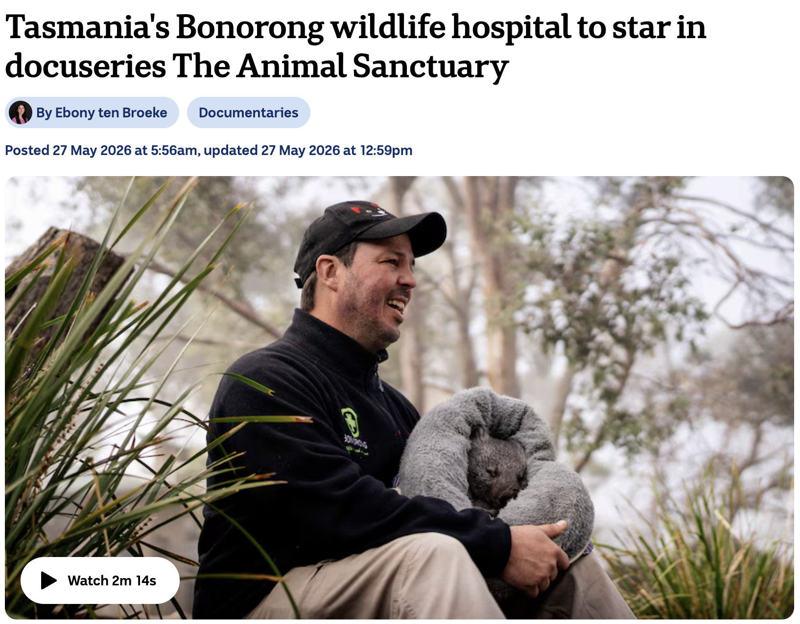 Greg Irons holding a wombat for a story on the Animal Sanctuary done by ABC