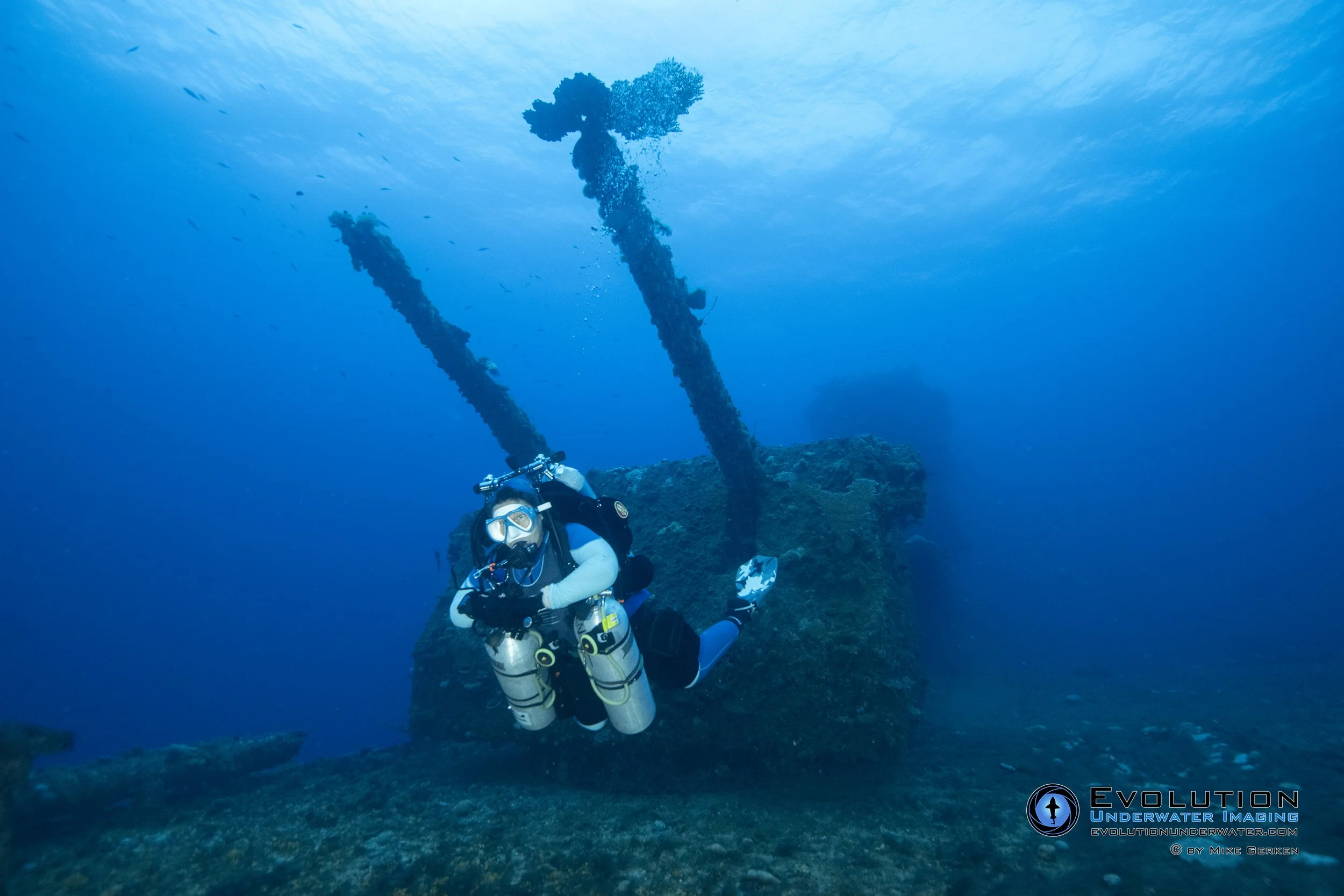 A scuba diver underwater on the flight deck of the wreck of the USS Saratoga in Bikini Atoll.