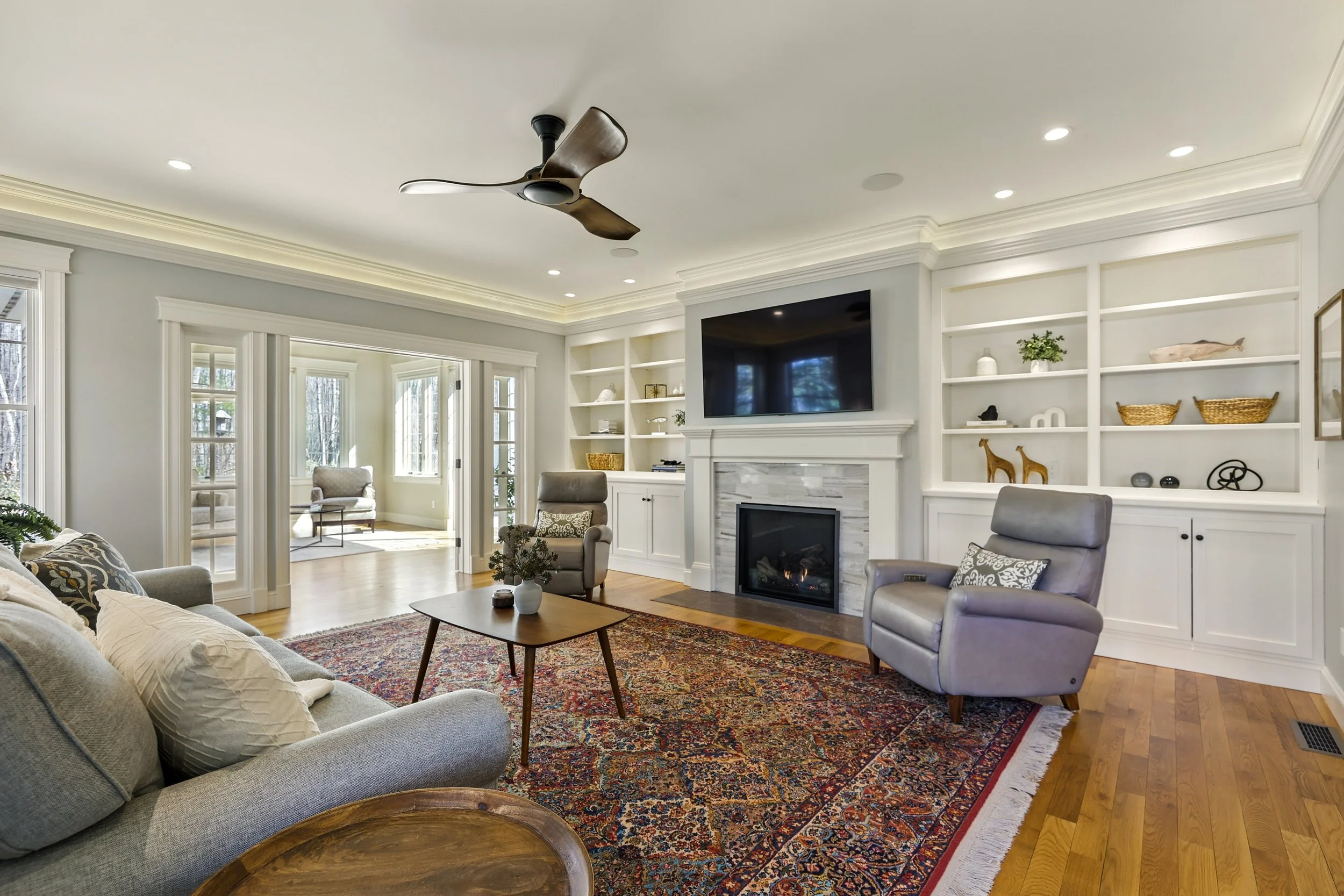 Northampton living room with fireplace and built-ins in a Northampton, MA home sold by Rhonda Cohen.