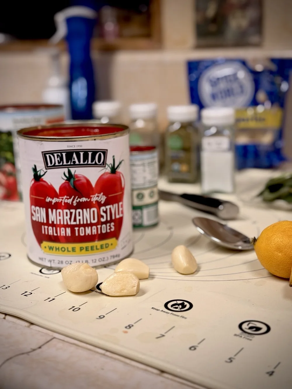 San Marzano tomatoes, garlic and ingredients on the Restaurant Method prep station
