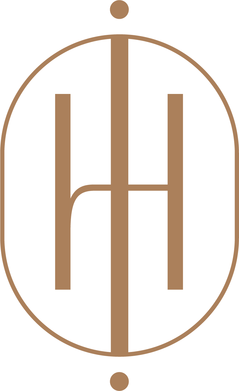 Design of the letters H and A integrated within an oval shape, featuring a small circle at the top and bottom.