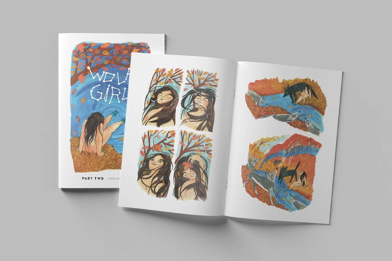 An open art book displaying colorful illustrations of a woman in nature, with trees, water, and animals, alongside a closed book titled 'WOLF GIRL' with a girl sitting in an autumn landscape.