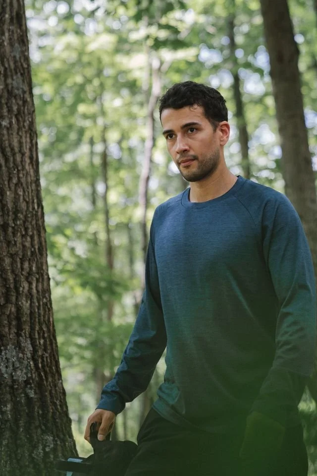 A man outside in a blue shirt