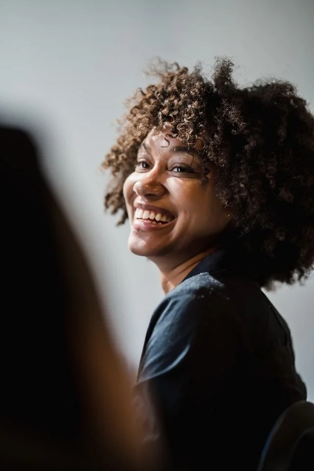 a woman smiling feeling good