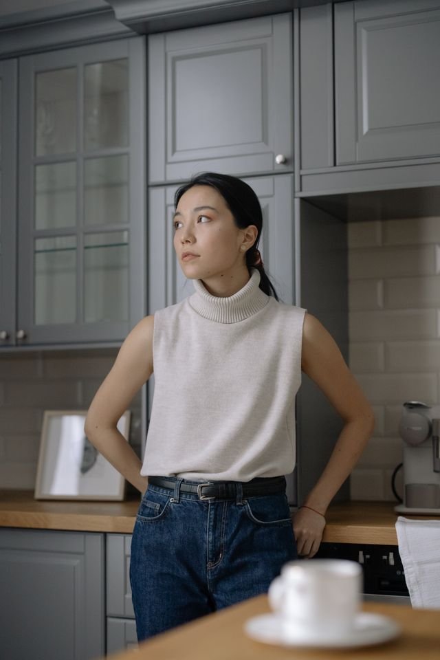 An Asian woman looking sad