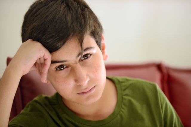 A teen boy looking at you