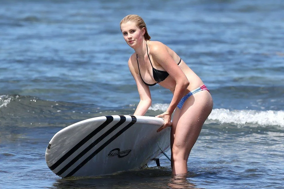 Ireland Baldwin Raising The Surfboard.jpg
