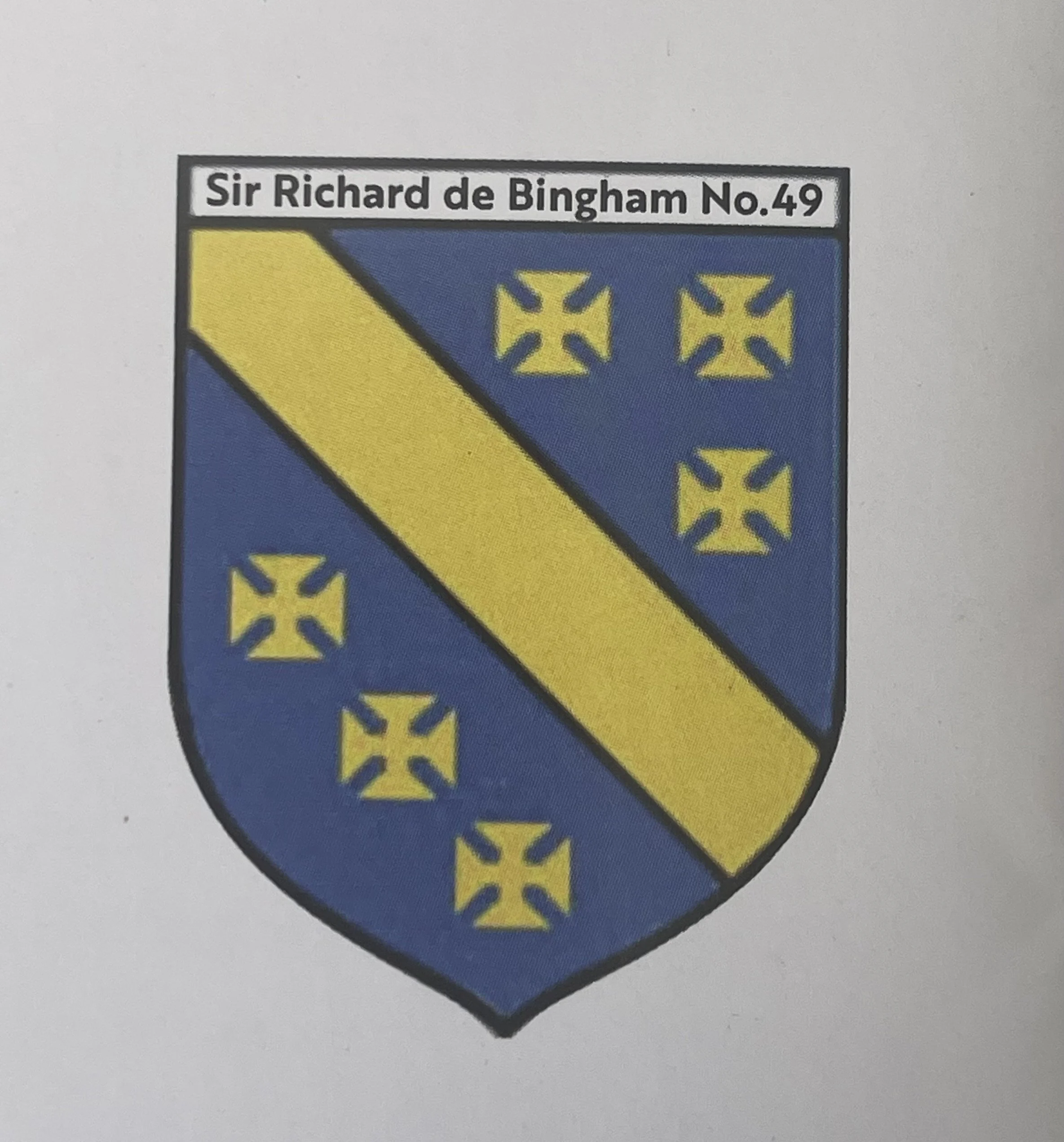 A heraldic shield with a blue background, a yellow diagonal band, and multiple yellow crosses, with a label above reading 'Sir Richard de Bingham No.49'