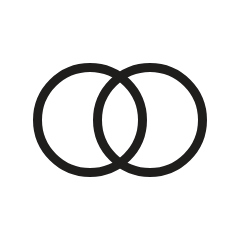 Close-up of two intertwined rings symbolizing merging or dividing entities.