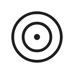 A black circle with concentric rings and a small dot in the center, resembling a target or focus symbol.