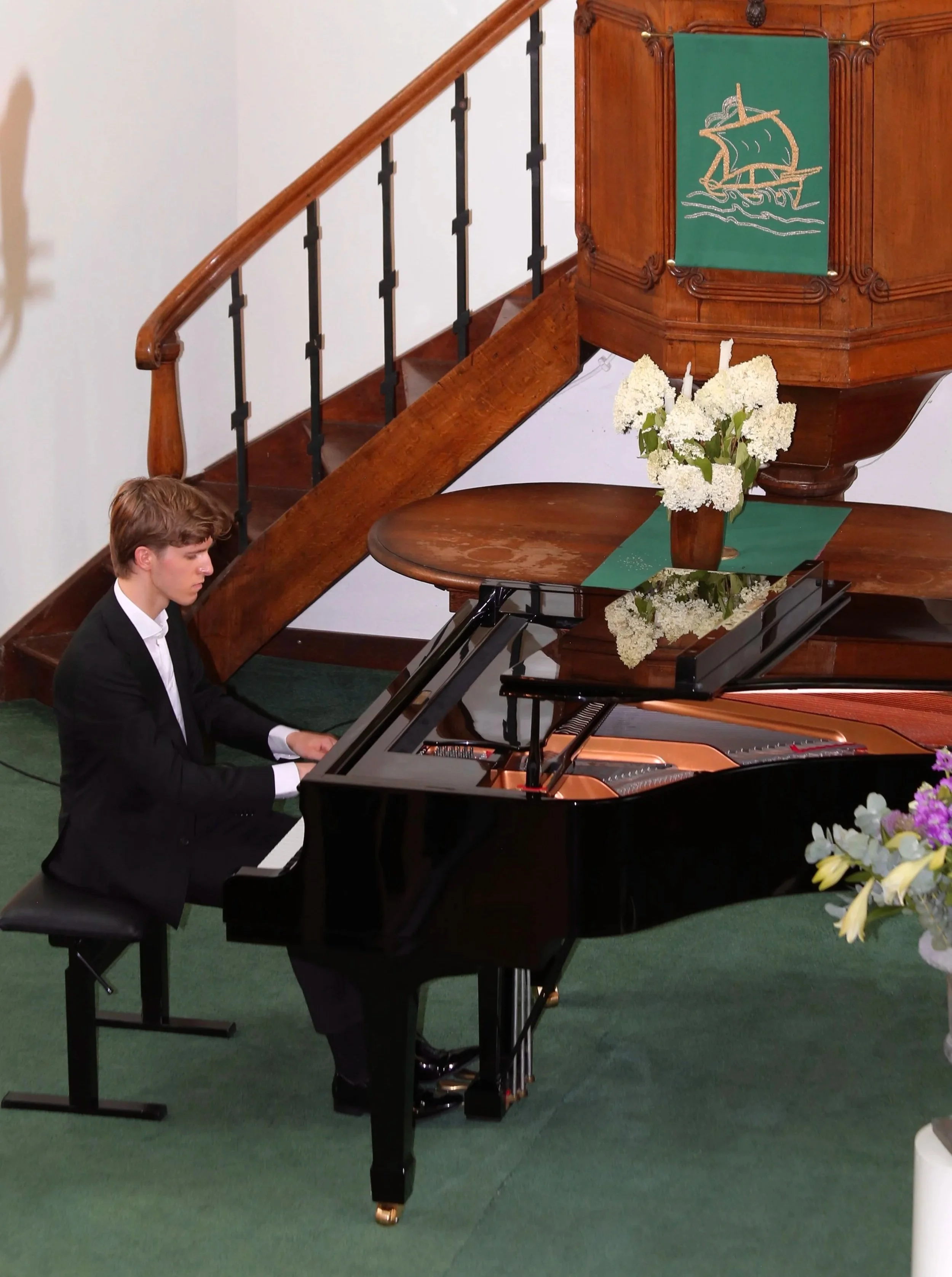 Max Valkenburcht Dombrowski performing a concert on a steinway grand piano in a local village in the netherlands
