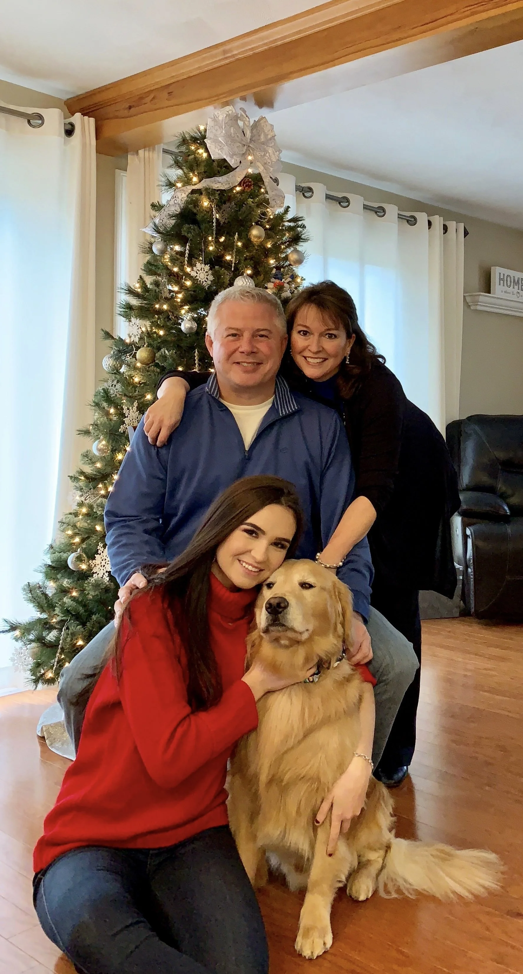 Karen Renaud with her family and dog at Christmas, reflecting the importance of relationships, connection and a meaningful life.