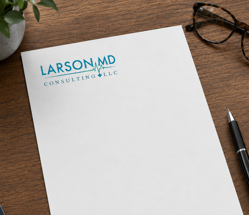 A blank white letterhead with 'Larson MD Consulting LLC' logo on a wooden desk, alongside a pair of tortoiseshell glasses, a black pen, and a potted plant.