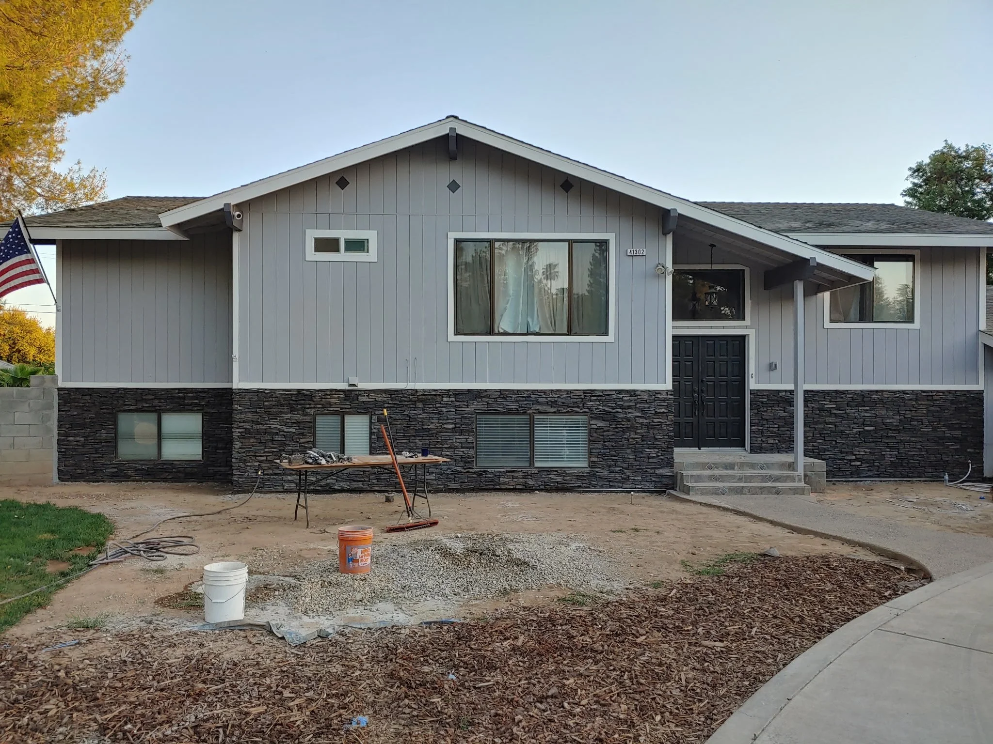 Exterior Rock Paneling and Gravel Landscape