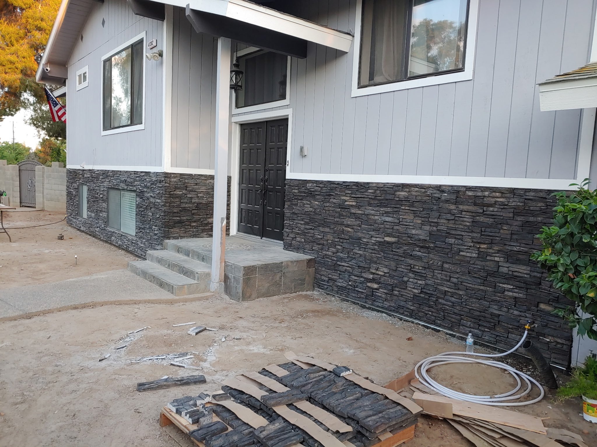 Exterior Rock Paneling and Gravel Landscape