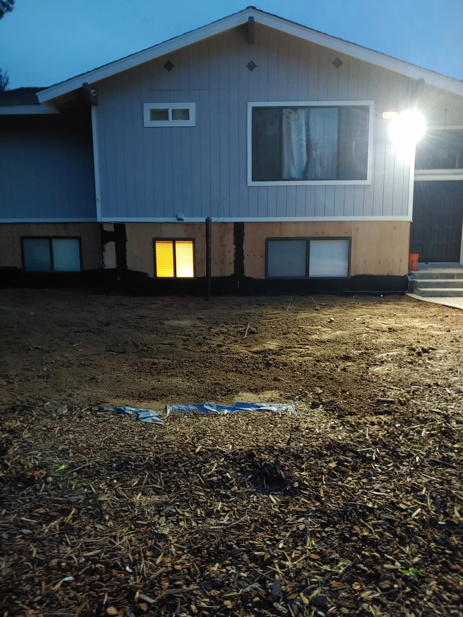 Exterior Rock Paneling and Gravel Landscape