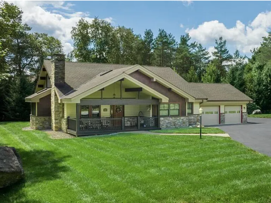 and adirondack style post and beam house with masonry, cedar siding and clapboards