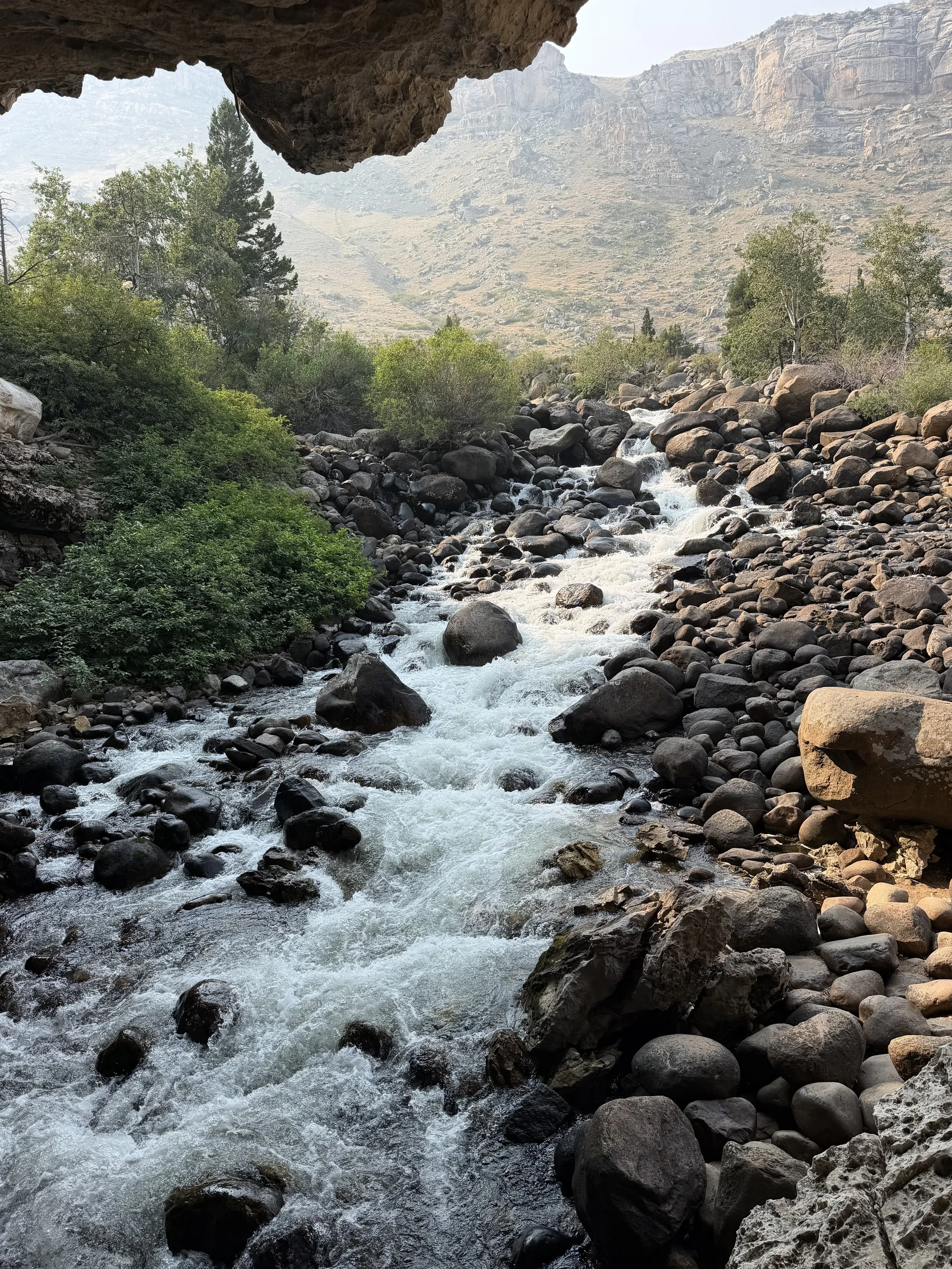 river rapids flowing over rocks.