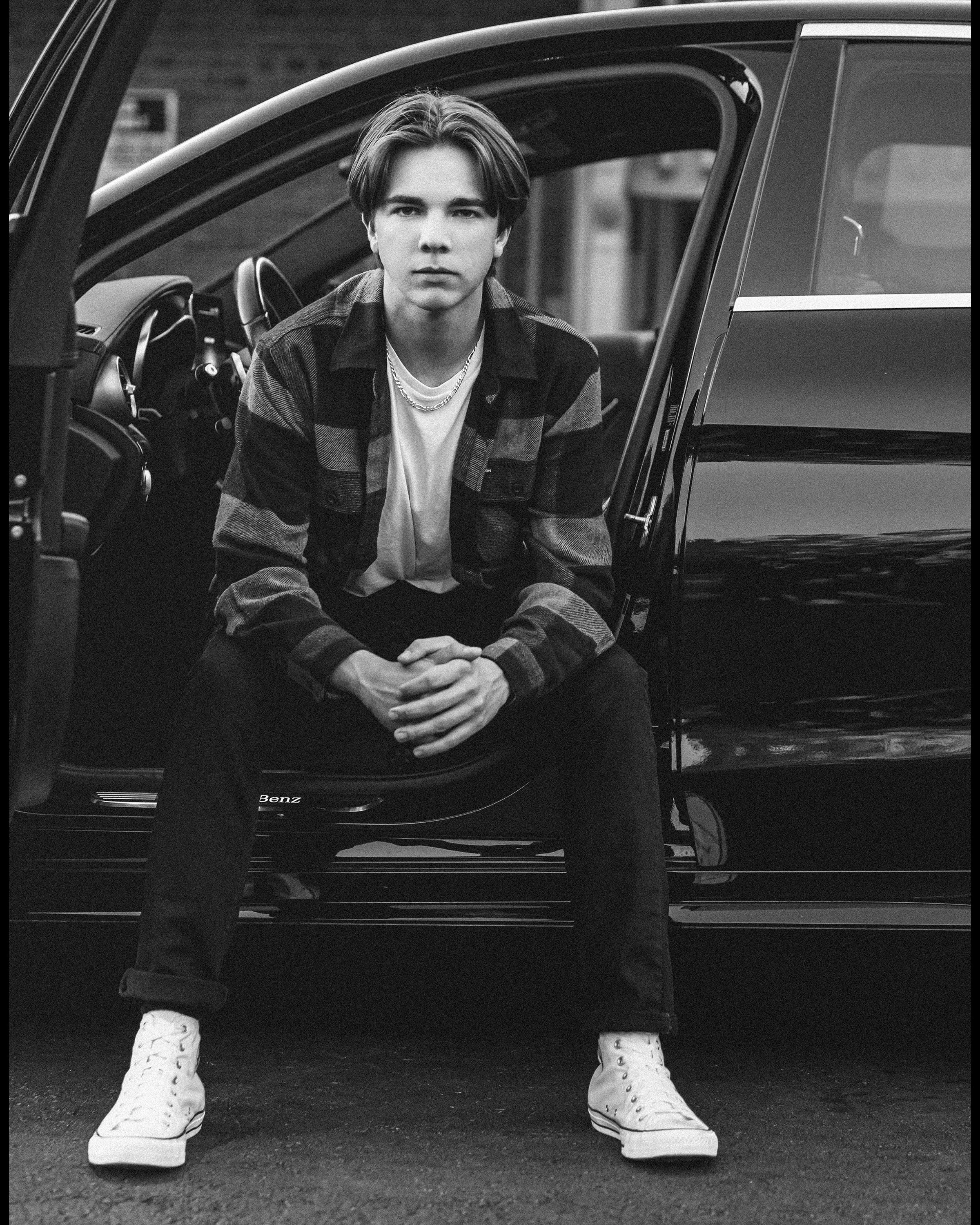 High school senior boy photographed inside a black Mercedes in Arroyo Grande, California.