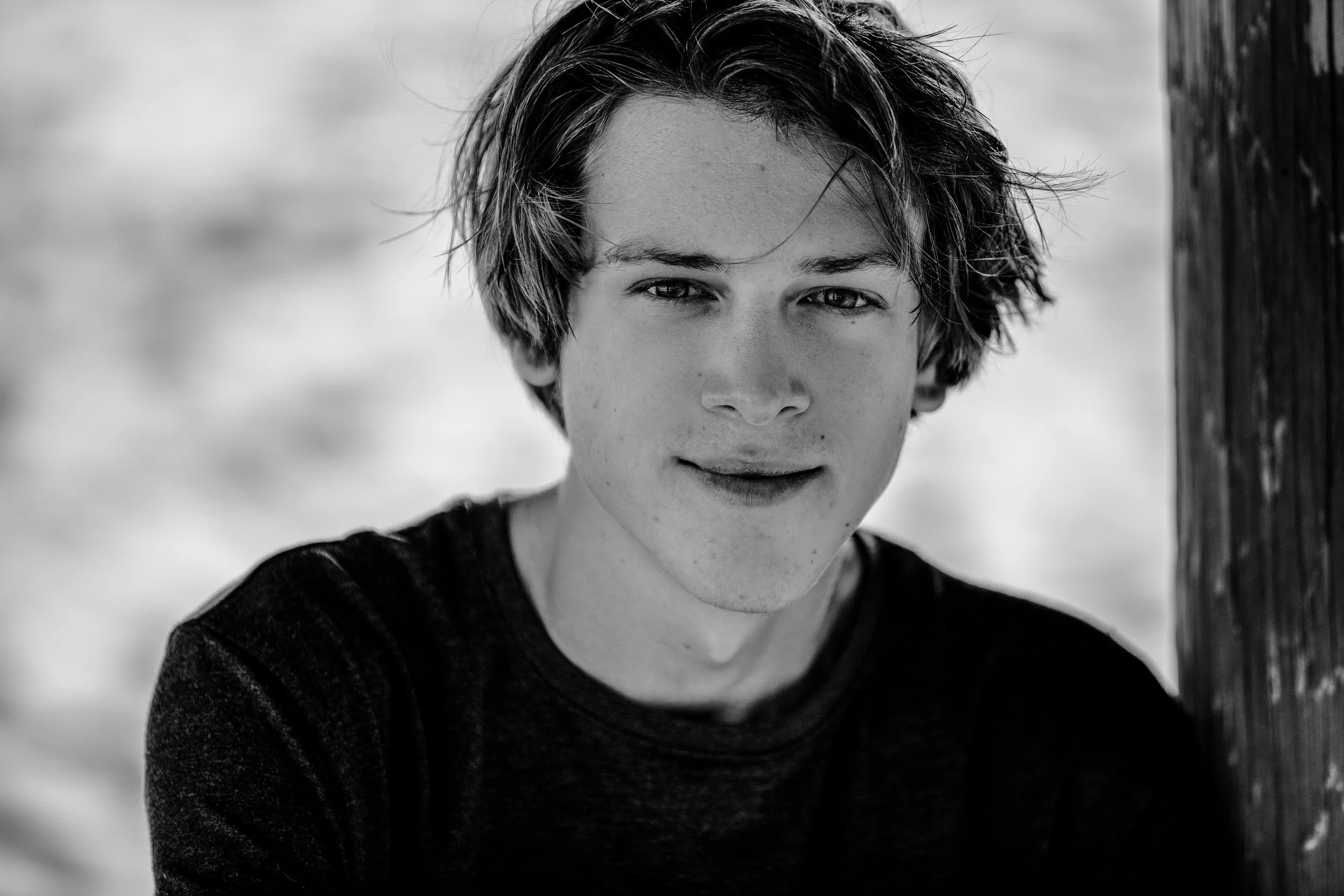 Black and white high school senior portrait photographed at Shell Beach in California.