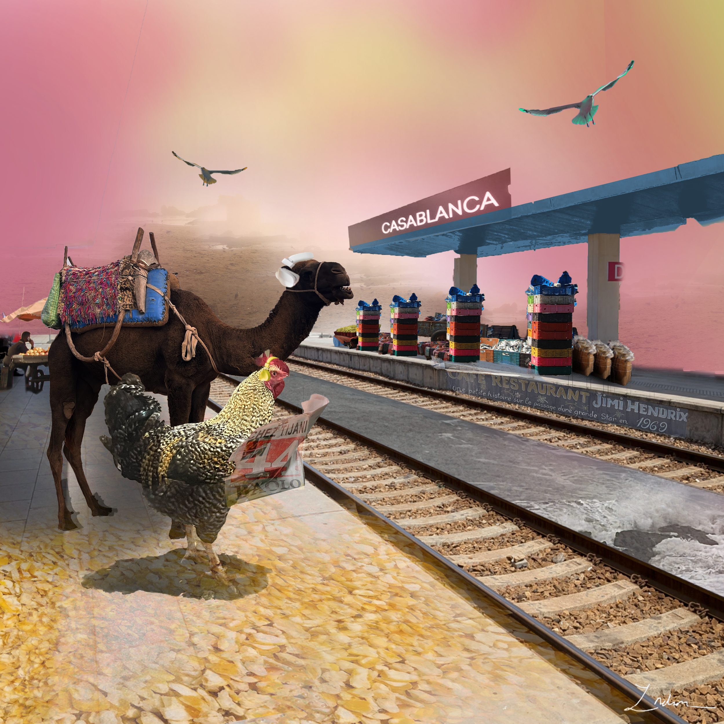 A camel with colorful fabric on its back standing near train tracks at sunset, with two birds flying in the pink sky.