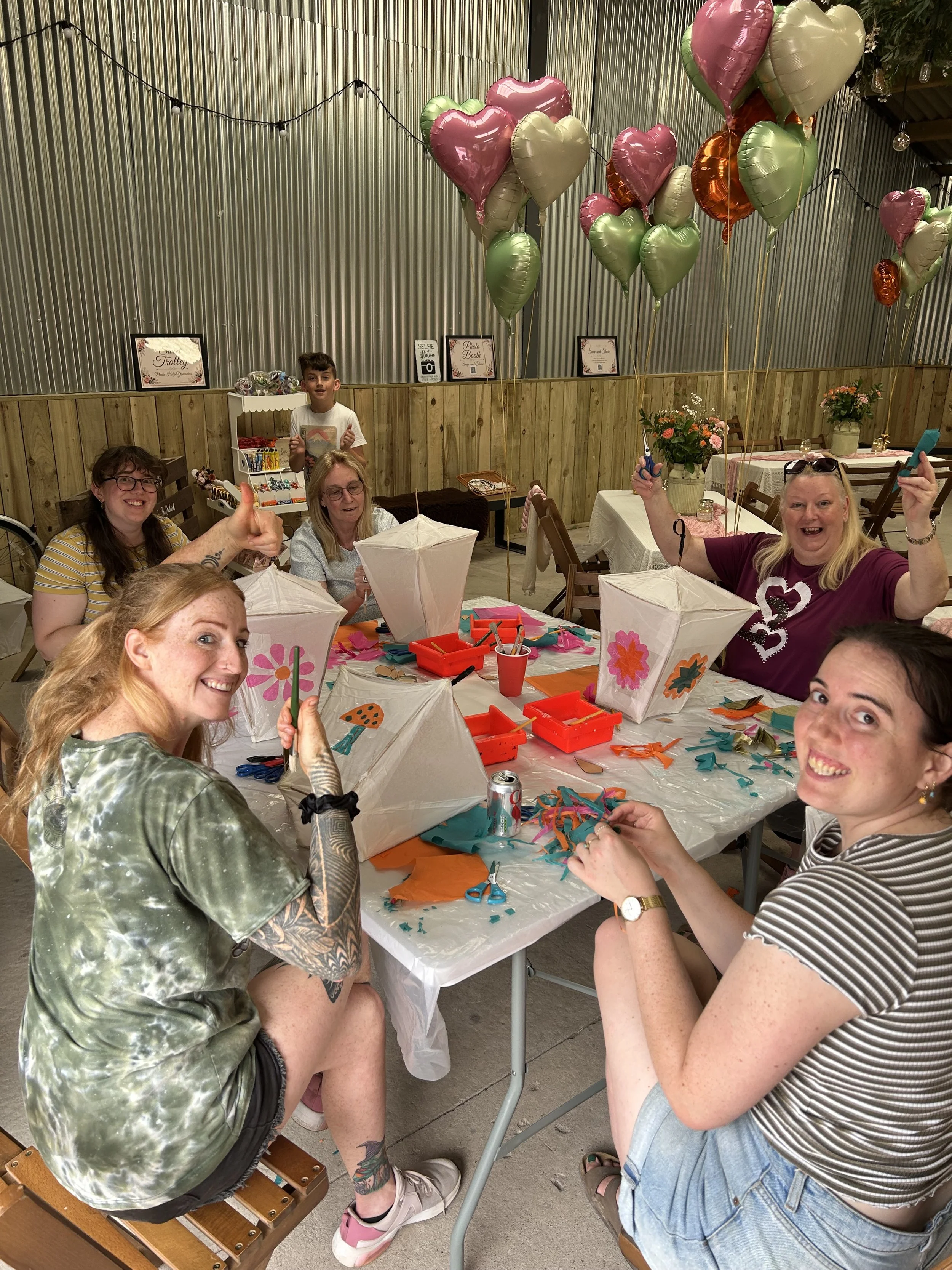 Group enjoying a creative workshop for a wedding or special occasion with CreatingART in Wales.