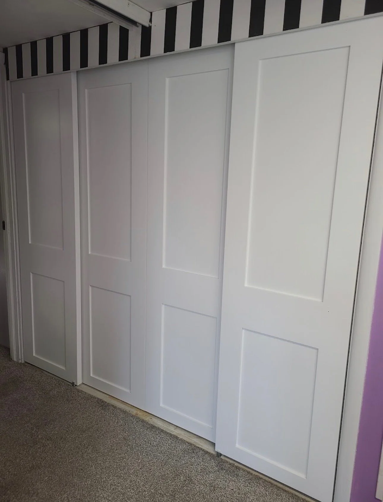 Custom solid wood sliding closet doors in Des Moines, IA.