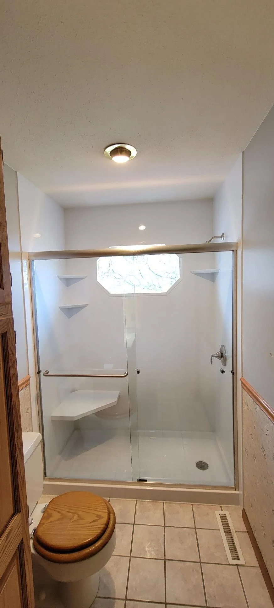 Bathroom with walk-in shower, custom glass door in Windsor Heights, IA.
