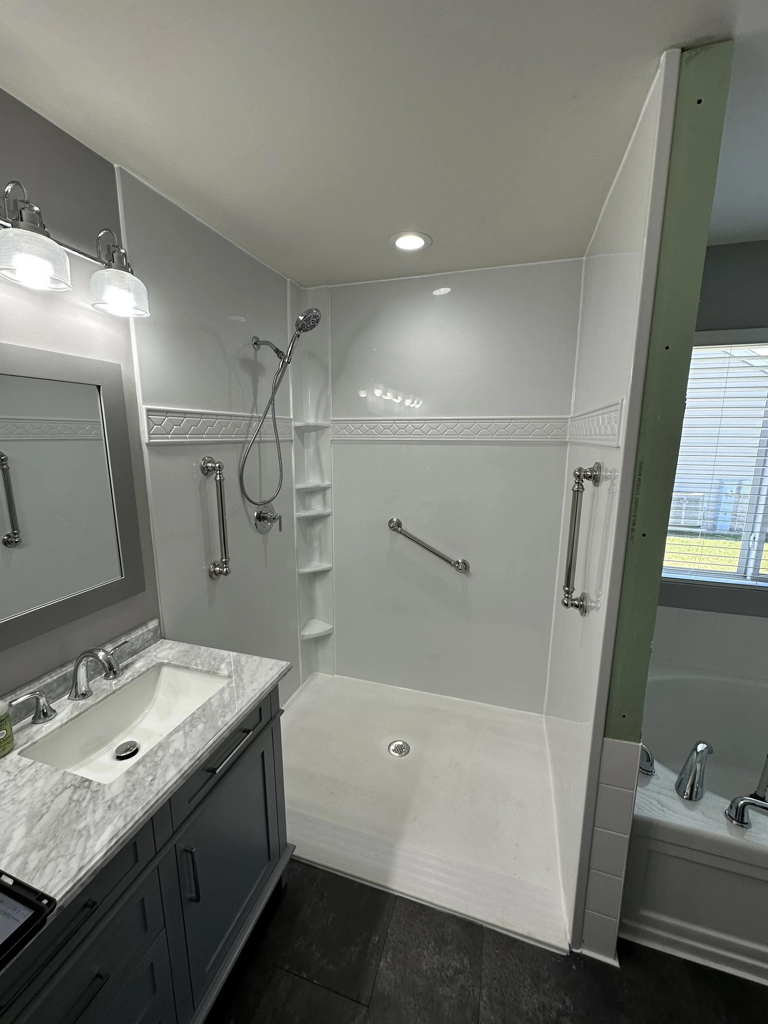 Full bathroom update in Ankeny, IA, featuring beautiful acrylic walk-in shower and new vanity.
