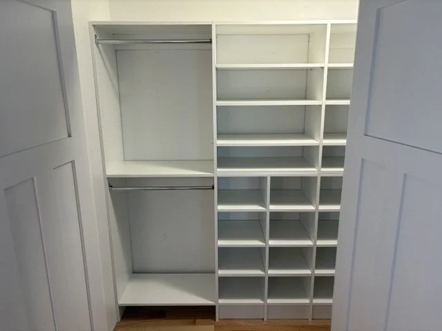 Custom closet system with shelves and hanging space added in Grimes, IA home.