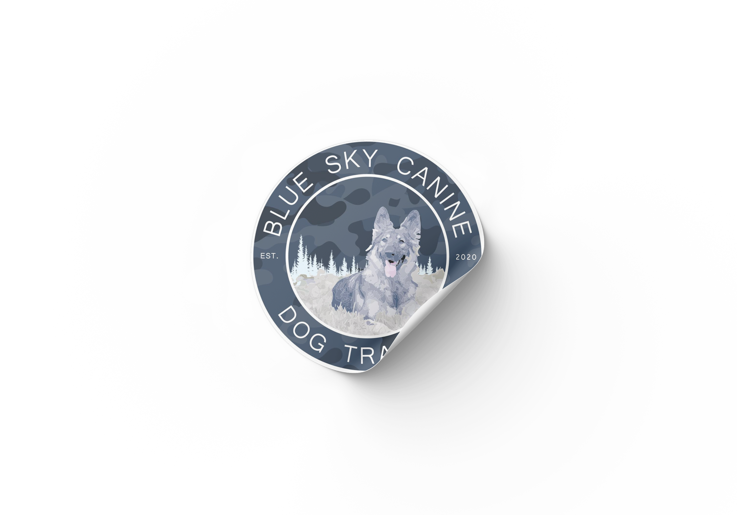 Sticker design with a wolf, trees, mountains, and the text 'Blue Sky Canine Dog Training 2020'.