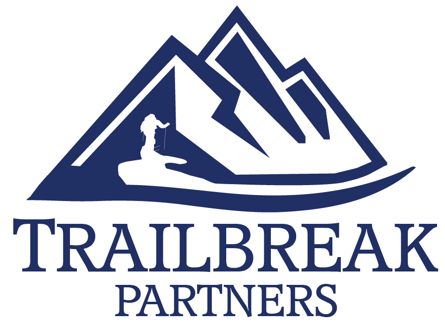 A stylized logo featuring mountains, a trail, and a tent with the words 'Trailbreak Partners' underneath.