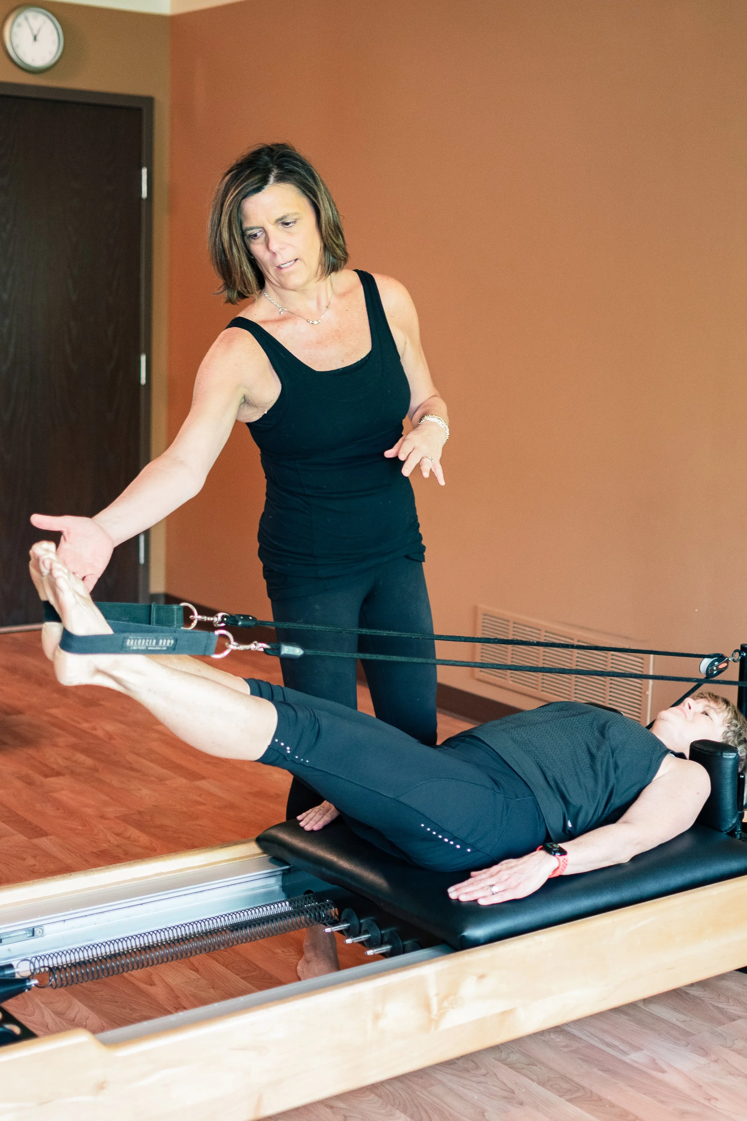 Rebecca Bell teaching small group pilates class in Fort Wayne, Indian at Mindful Movements Pilates Studio