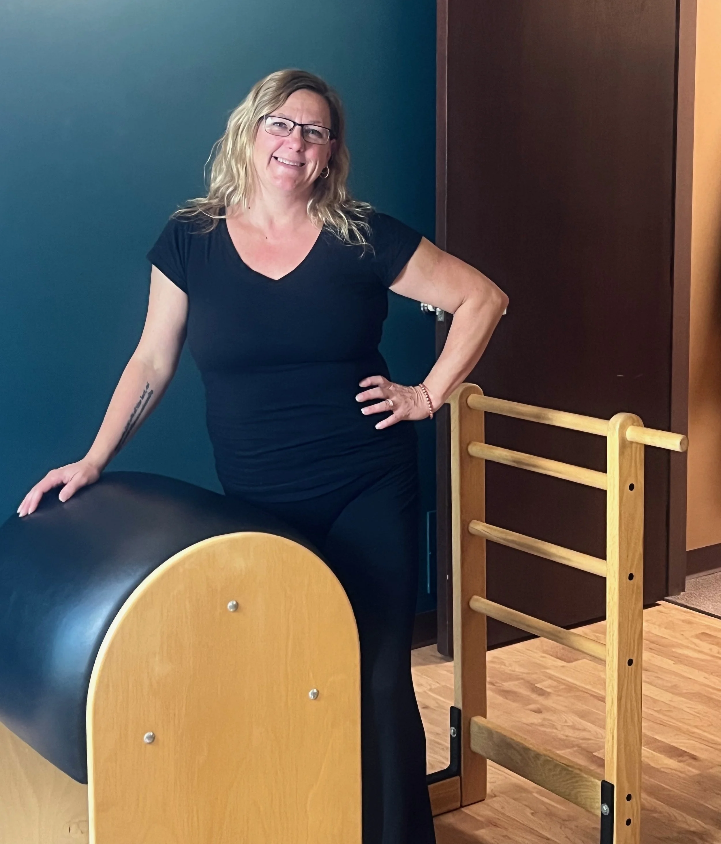 Dylann Miklaszewicz instructor at Mindful Movements Pilates Studio in Fort Wayne, Indiana who teaches private pilates sessions and small group reformer pilates classes
