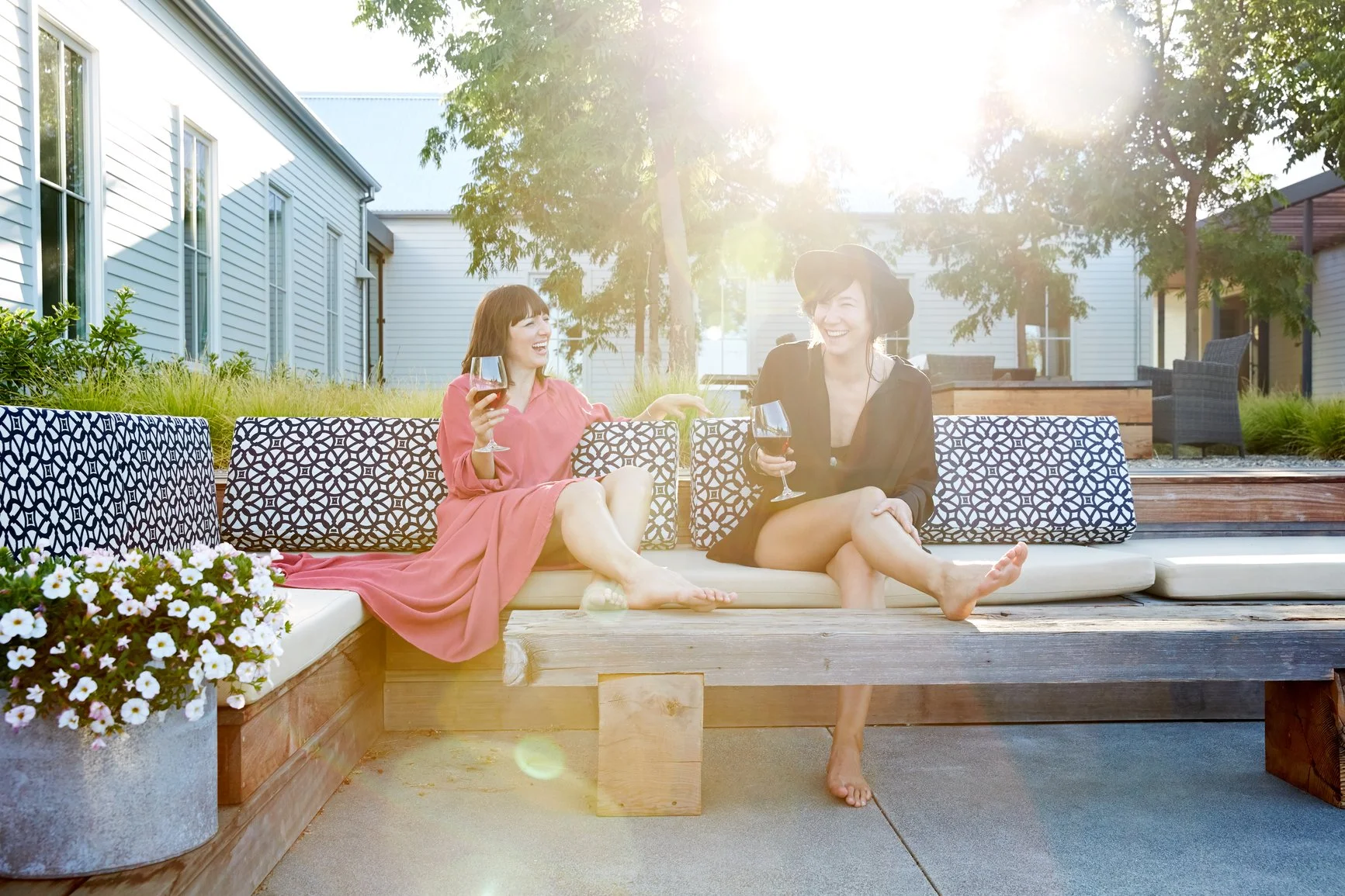 Two women laughing and talking on a women's retreat