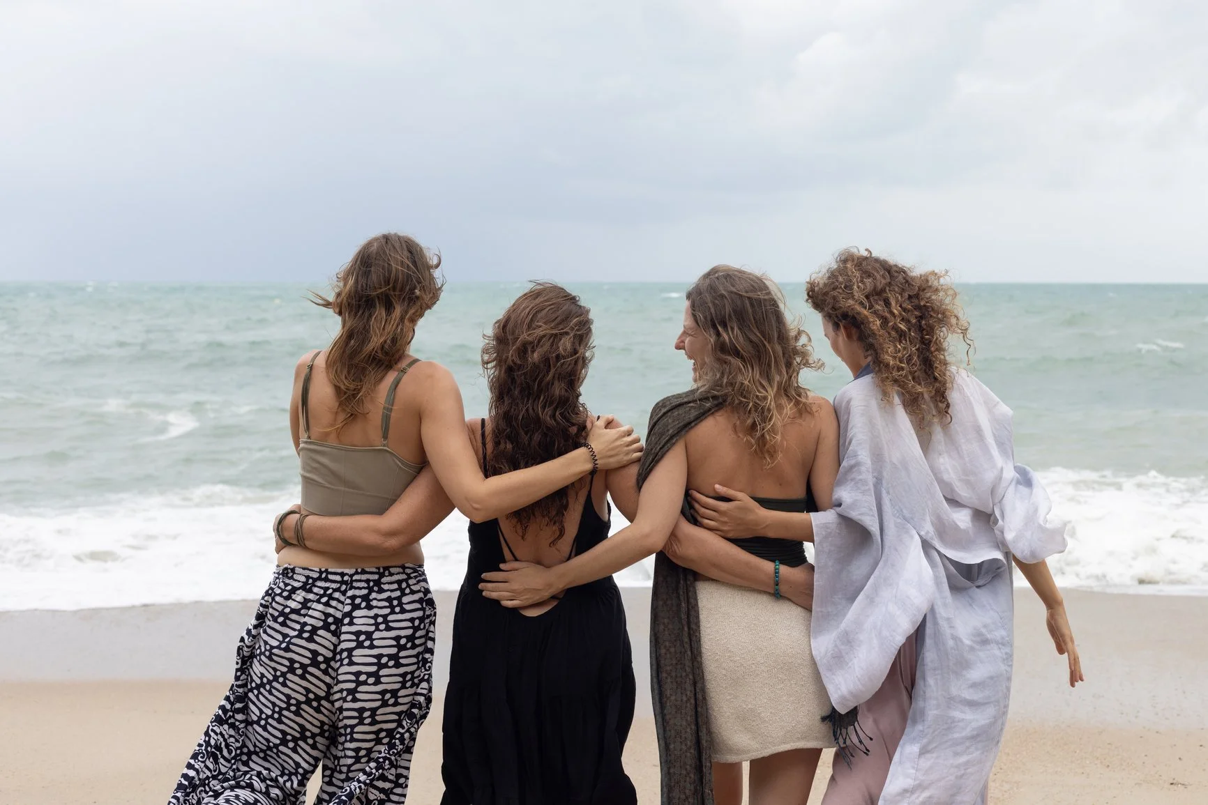 Group of friends together on the beach at a girls weekend