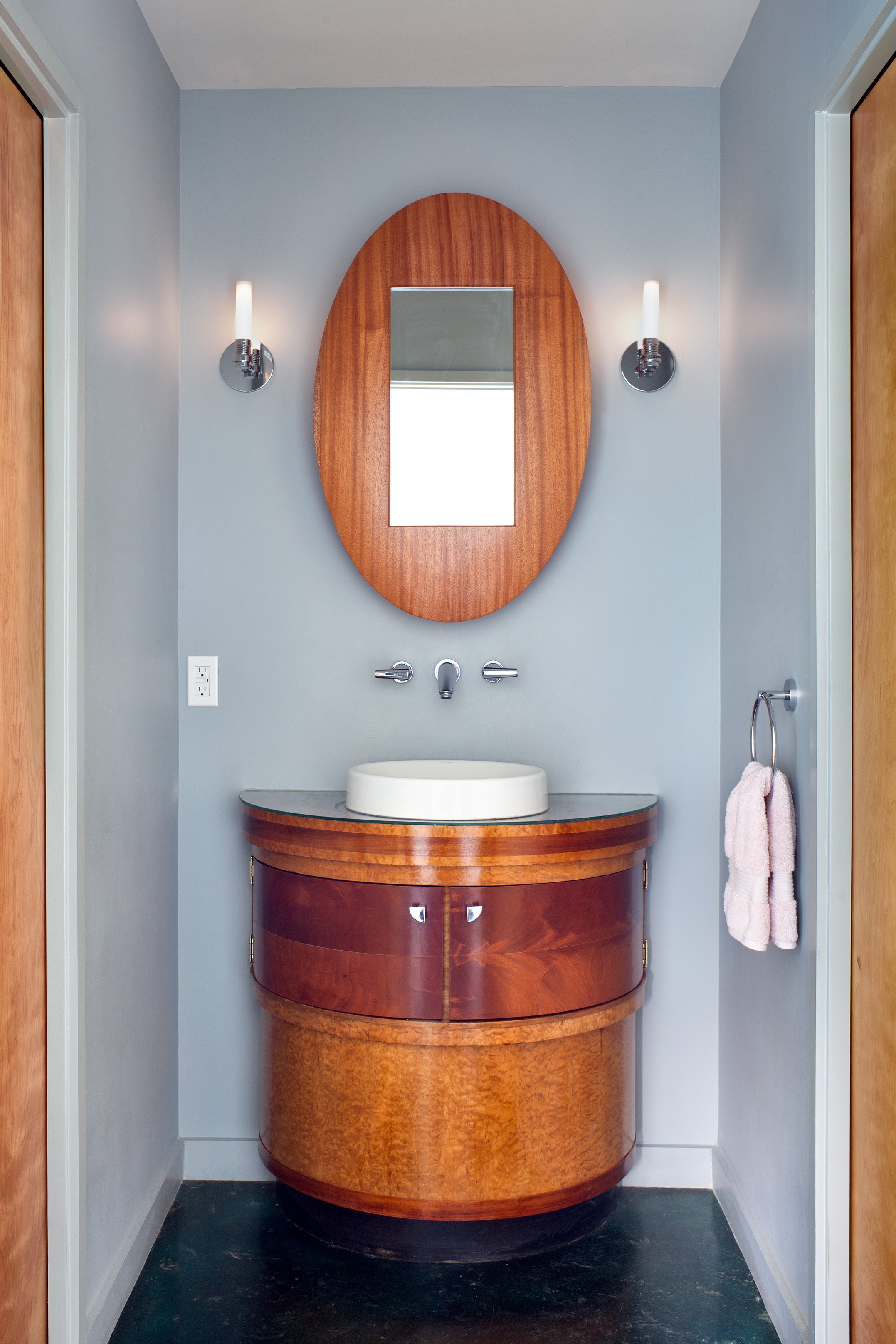 Bathroom lavatory. Repurposed vintage Art Deco stand; mirror cabinet by Peter Zubiate. Devine Street Residence, San Antonio, Texas, 2009. Photo by Chris Cooper Photography