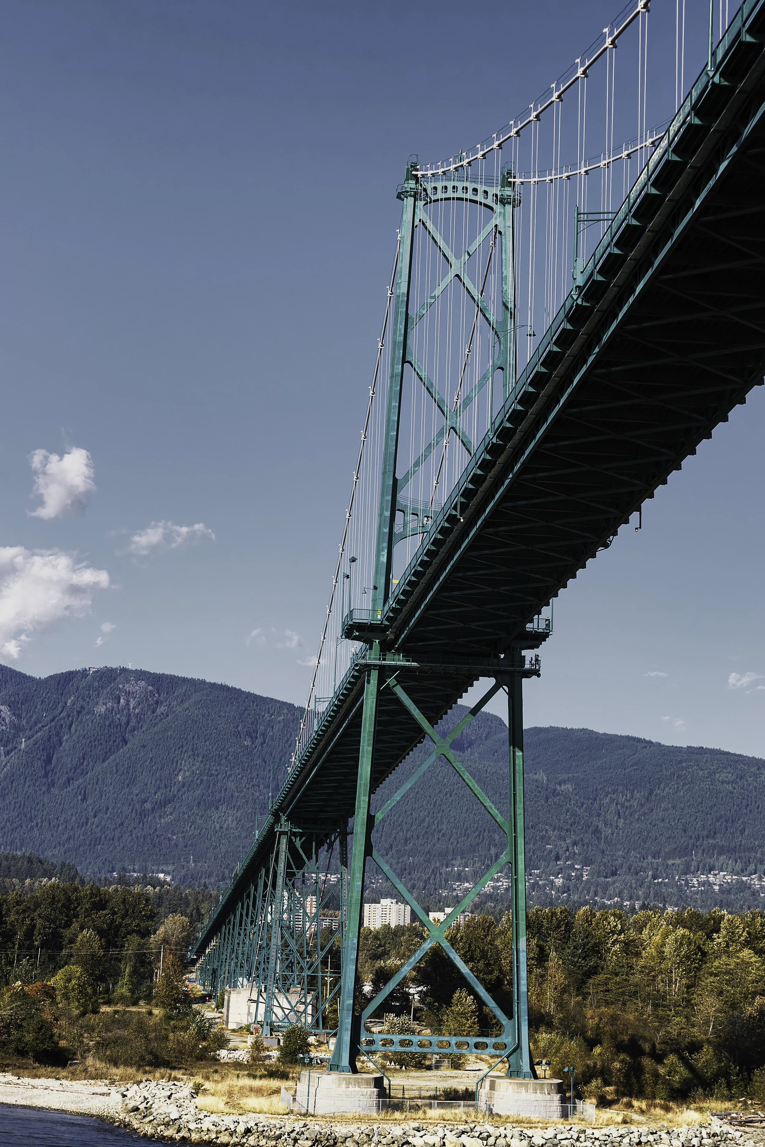 "Lion's Gate Bridge"- A architectural portrait of Vancouver’s iconic Lion’s Gate Bridge, as it stretches toward the North Shore mountains under a clear coastal sky.