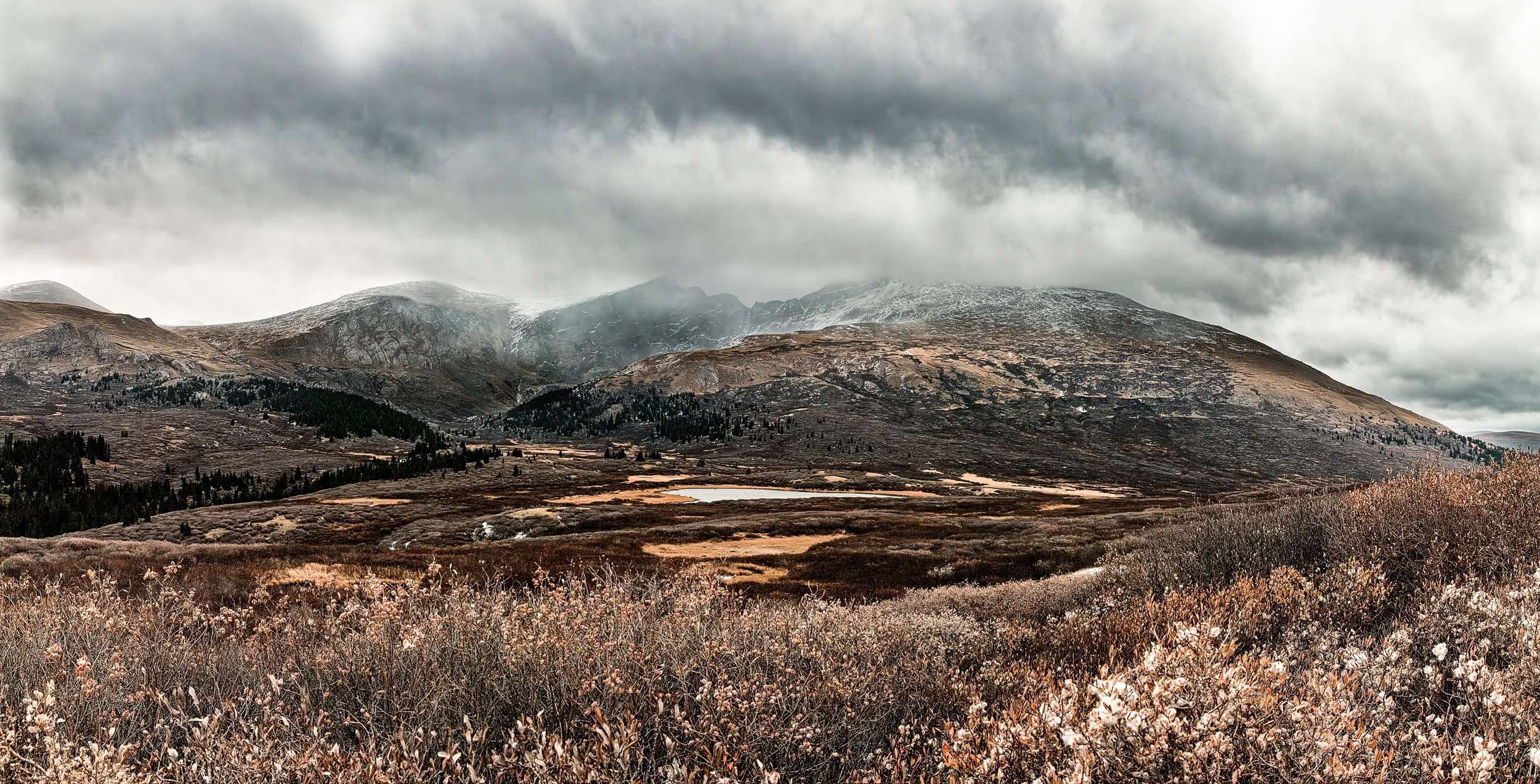 "Storm over Guanella Pass"- Dark clouds sweep across Guanella Pass, Colorado, casting a moody light over rugged alpine terrain and autumn’s fading hues.