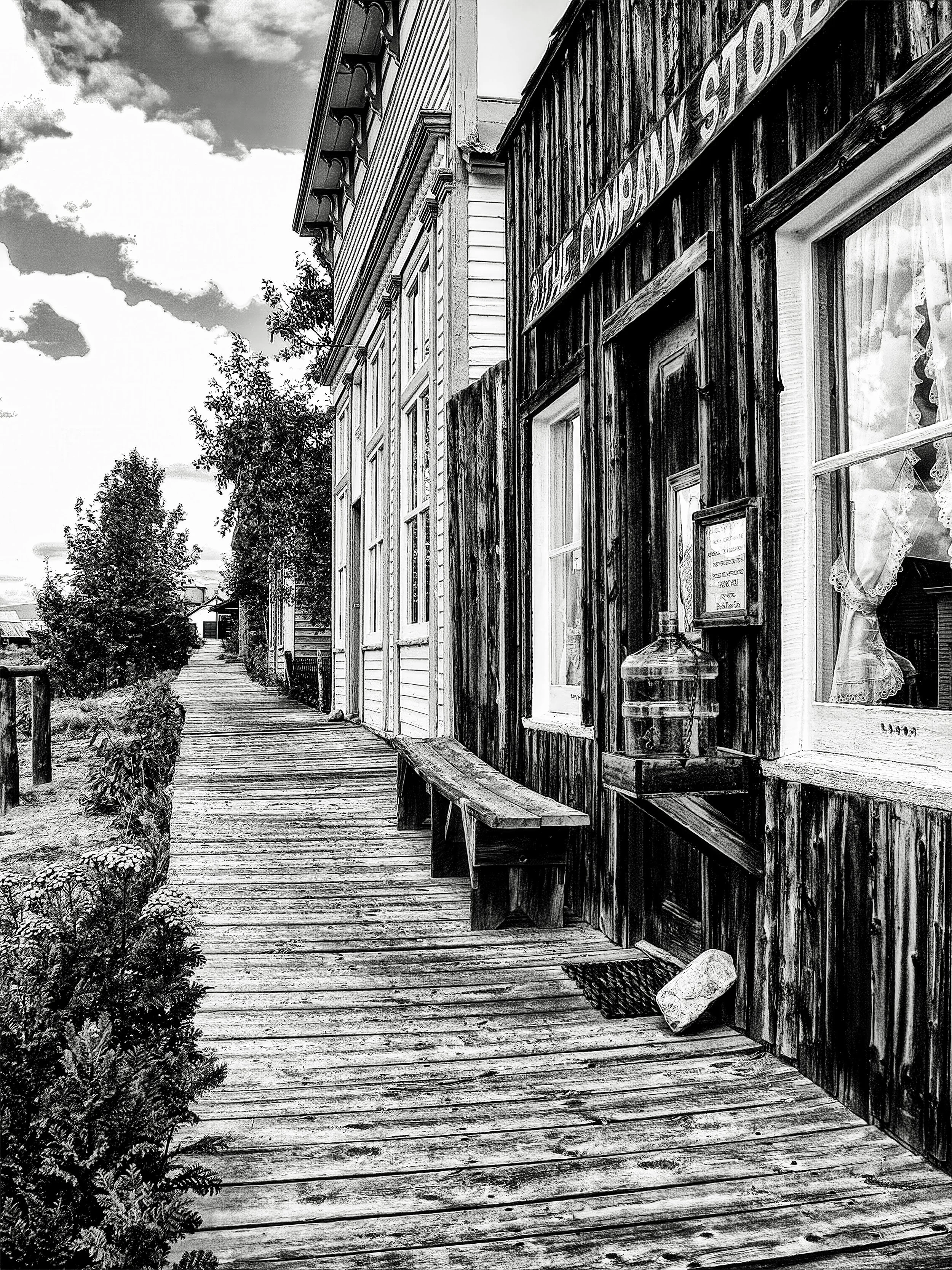 "The Company Store" - A nostalgic black and white capture of historic South Park, Colorado—weathered wood, lace curtains, and the timeless stillness of a frontier town.