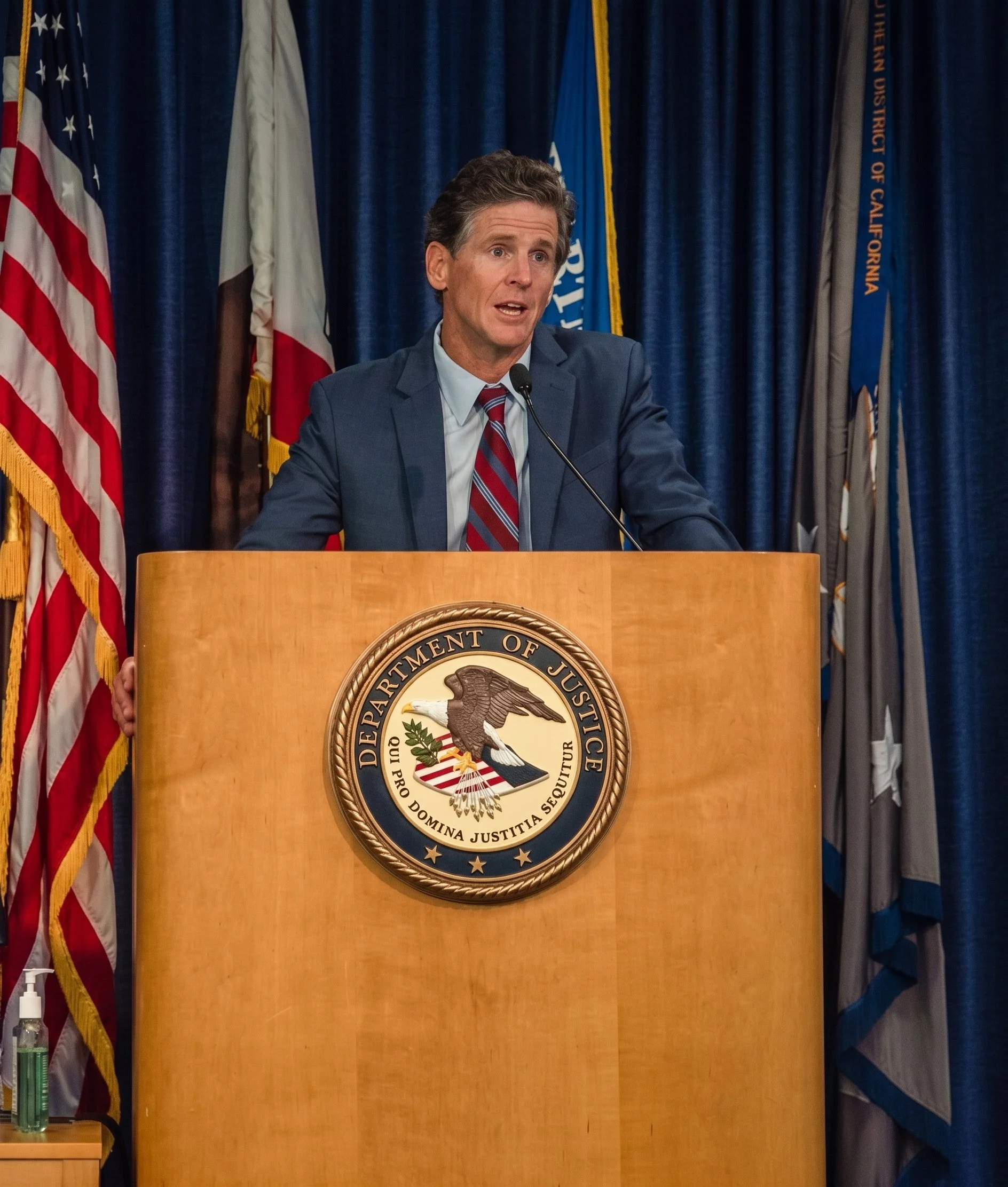 Addressing the media regarding Gina Champion-Cain Ponzi scheme.