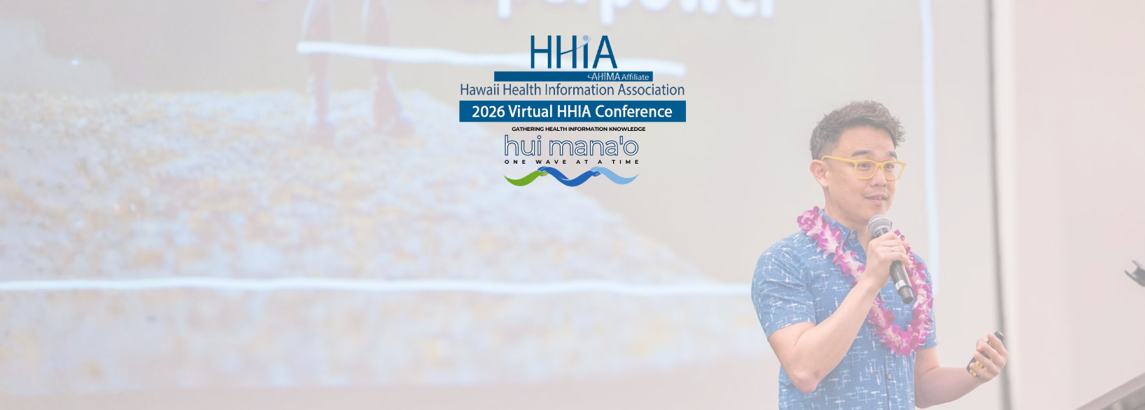 A man with glasses and a leis around his neck speaking into a microphone at a Hawaii Health Information Association virtual conference, with a presentation slide in the background.