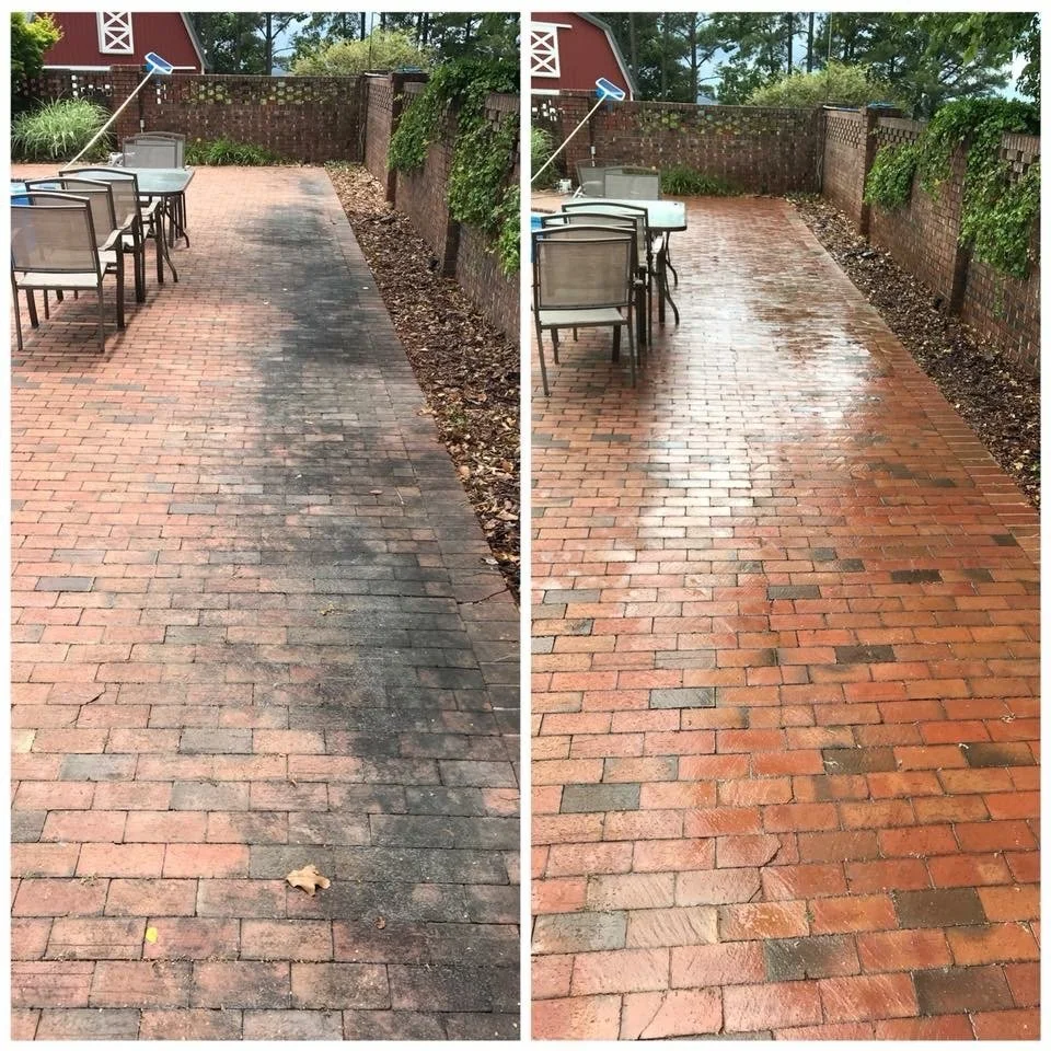 Side-by-side comparison of a brick patio before and after cleaning. The left side shows the patio with dark, dirty, and stained bricks, while the right side shows the bricks cleaned and restored to their original reddish-brown color. There are outdoo