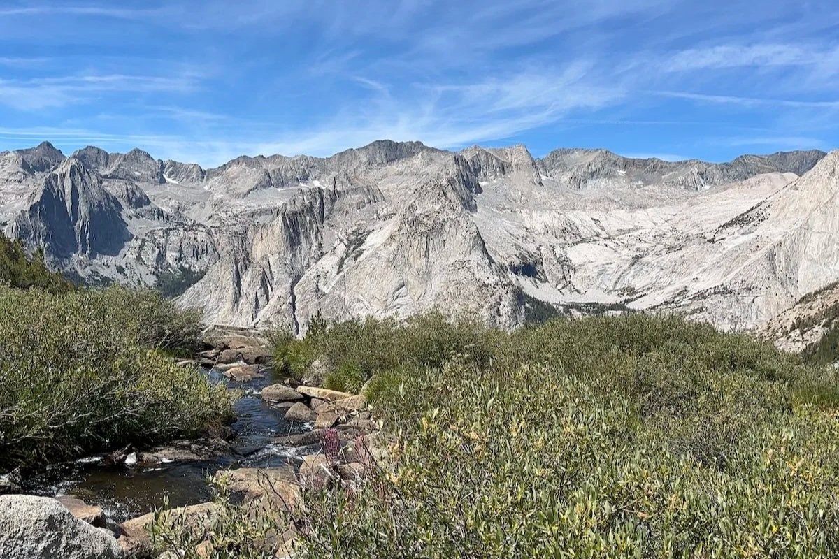 Mountains, blue sky, grass, rocks, hiking