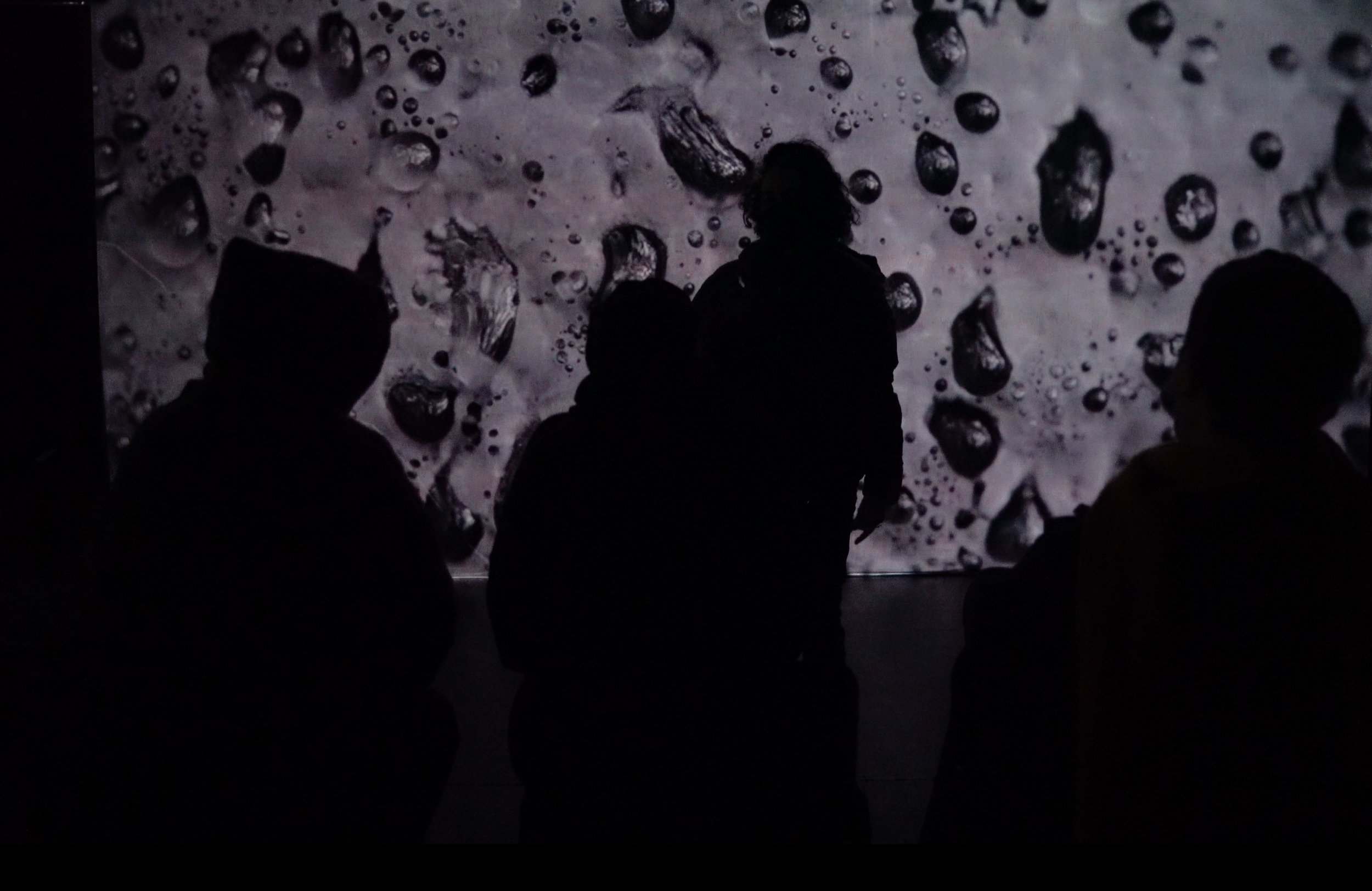 video installation  against witch washig whith audience