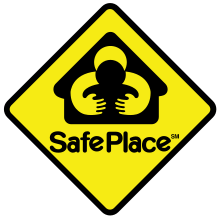 A yellow diamond-shaped sign with black border, featuring a person holding a child's shoulder, and the words 'SafePlace' at the bottom.