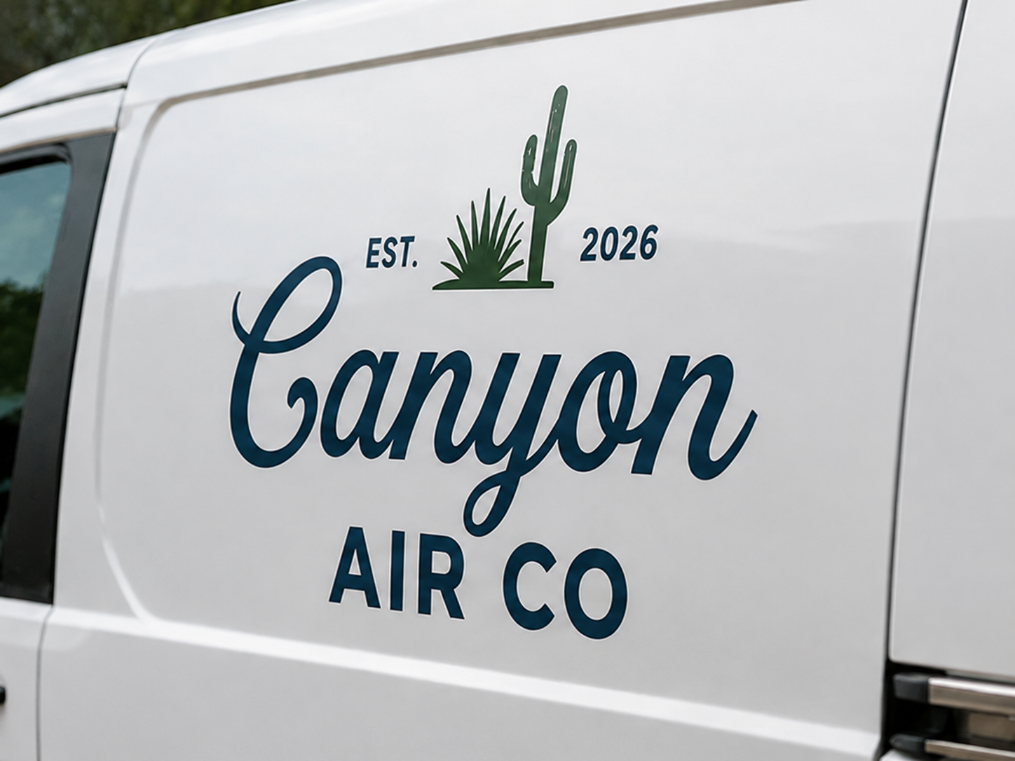 White vehicle with a logo that reads "Canyon Air Co" and a graphic of a cactus and agave plant, with text indicating establishment in 2026.