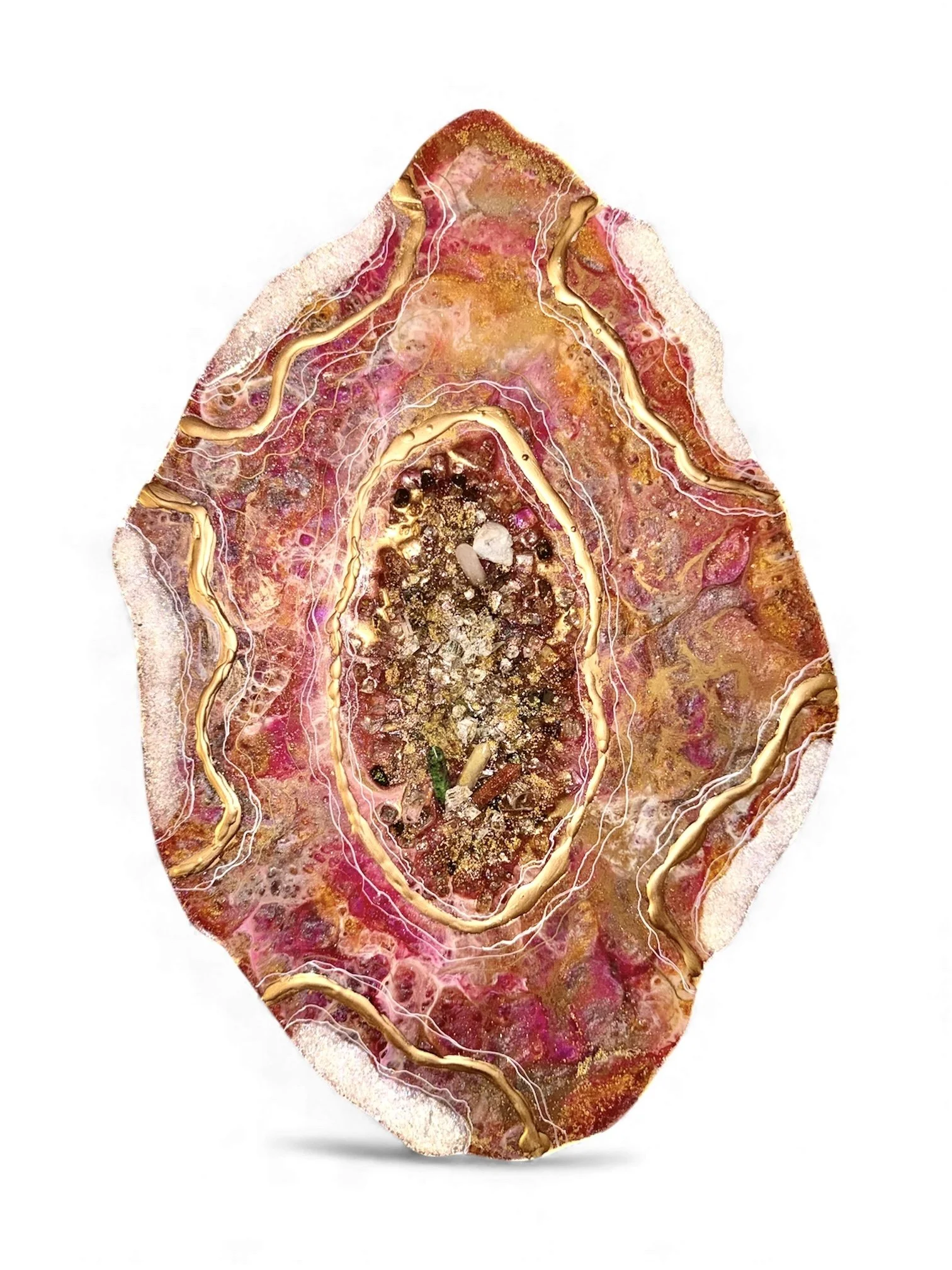 A polished, semi-precious mineral or geode slice with pink, gold, and brown hues, featuring intricate internal patterns and gold-colored veins.