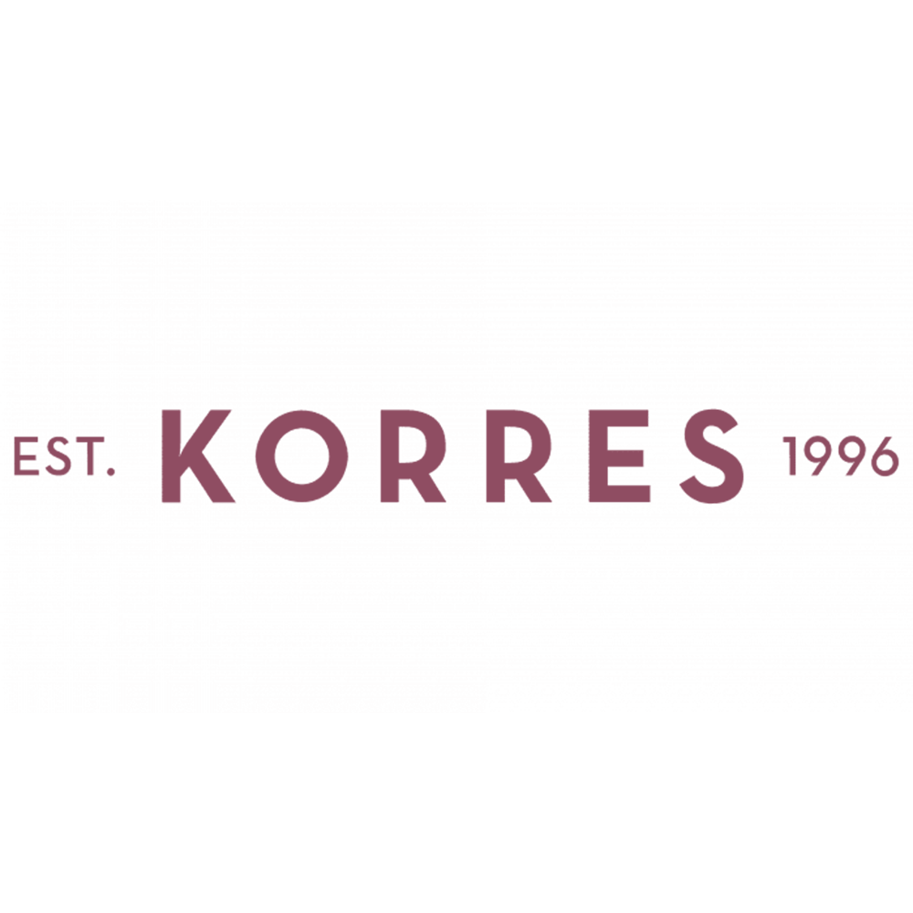 Close-up of a fabric label with the brand name 'KORRES,' established in 1996, embroidered in purple thread.
