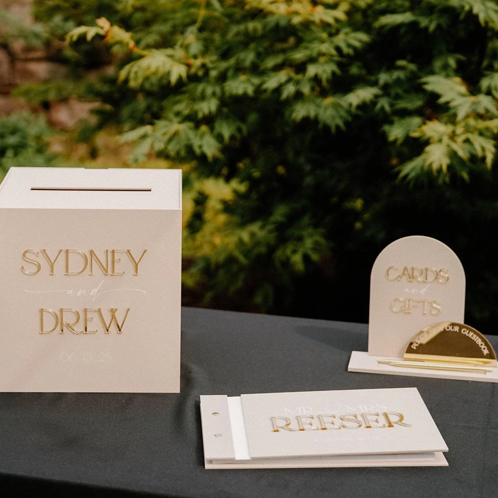 Matching oyster acrylic wedding card box, dome guestbook duo sign and personalised guestbook.
